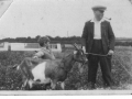 Ken Robinson with uncle and goat 1937