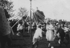 The Maypole dance at The War Memorial Hall on the occasion of King George V. Silver Jubilee.