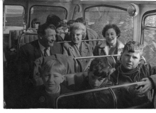 Adults and children on a school bus trip c1965