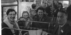 Adults and children on a school bus trip c1965