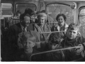 Adults and children on a school bus trip c1965