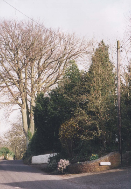 AAPC-6-1-047 -- Church Road, looking east -- entrance to Coach House and The Manor -- 2000