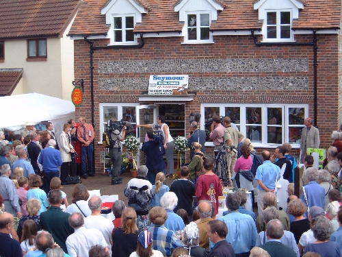 Jackie Stanton opening the Village Shop door