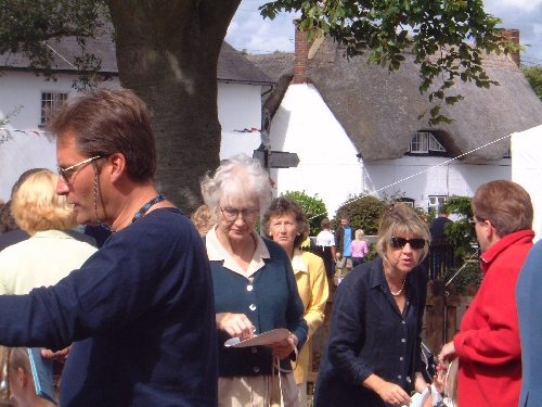 Villagers departing from the shop to the fete in Duck Street