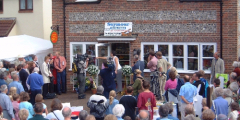 Jackie Stanton opening the Village Shop door